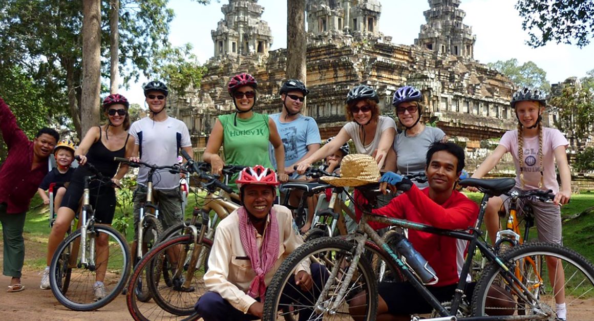 Families with young children in front of temple in Angkor Wat park