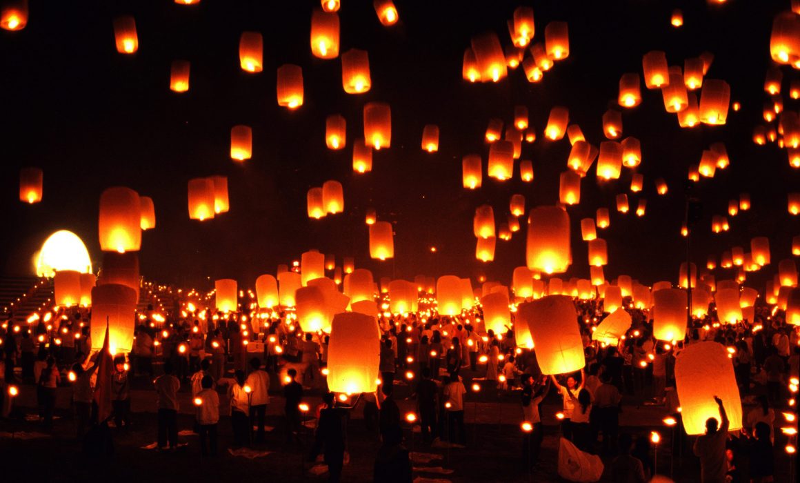 Lanterns floating in the air for Loy Kratong festival in Thailand