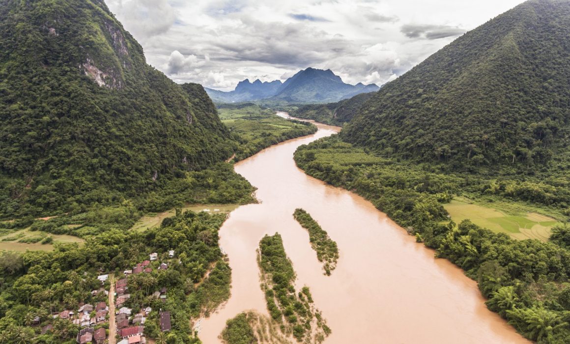 Mekong River surrounded by mountains in Northern Laos