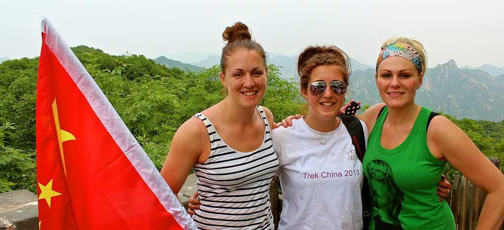 Three travelers in front of mountain views in Vietnam